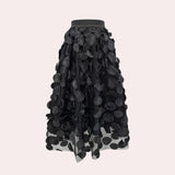 Luxury high-waist black skirt featuring a detailed 3D floral design, showcasing intricate patterns with a stylish and elegant appearance suitable for fashion-forward women.