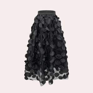 Luxury high-waist black skirt featuring a detailed 3D floral design, showcasing intricate patterns with a stylish and elegant appearance suitable for fashion-forward women.