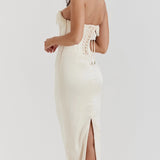 Luxury ivory embroidered bridal gown featuring a beaded corset, showcasing intricate detailing on the bodice, with elegant sleeves and a flattering neckline.