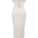 Elegant ivory bridal gown featuring intricate embroidery and a beaded corset with sheath silhouette, showcasing detailed patterns and design elements.