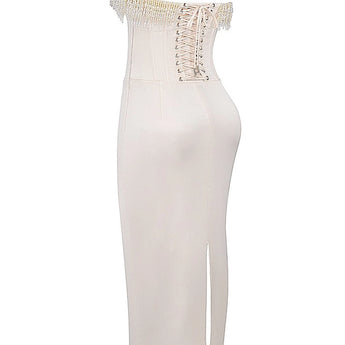 Luxury ivory embroidered bridal gown featuring a beaded corset with a sheath silhouette, sleeveless design, and intricate detailing, perfect for a modern and elegant wedding look.