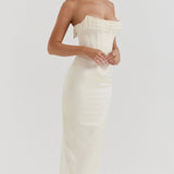 Luxury ivory strapless bridal gown featuring intricate embroidery and a beaded corset, highlighting an elegant neckline and fitted bodice for a sophisticated bridal look.