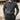 Luxury men's outfit featuring a beige knit polo sweater with a neatly tailored collar and a pair of vintage pleated trousers in a sophisticated gray tone, creating a classic and elegant look.