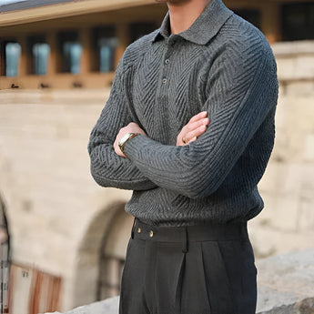 Luxurious men's beige knit polo sweater paired with vintage pleated trousers, showcasing a sophisticated style with attention to detail in the collar, sleeves, and overall fit.