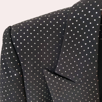 Luxury men's designer polka dot suit featuring a tailored blazer and trousers, showcasing a pattern of electric blue dots on a sleek material with detailed craftsmanship and symmetrical design.
