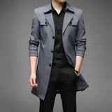 Luxury men's navy satin dress shirt in a tailored fit, featuring a button-down collar. The shirt is stylishly paired with charcoal grey suit trousers and a blazer, highlighting the sleek modern look. The model is wearing the shirt in a fashionable XXL size, showcasing a sophisticated and polished appearance.