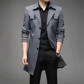 Luxury men's navy satin dress shirt in a tailored fit, featuring a button-down collar. The shirt is stylishly paired with charcoal grey suit trousers and a blazer, highlighting the sleek modern look. The model is wearing the shirt in a fashionable XXL size, showcasing a sophisticated and polished appearance.