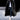 Luxury men's oversized designer winter fur coat in black, size 4XL, featuring a grey overcoat design with a sophisticated collar and long sleeves, modeled by a person wearing eyewear.