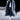
Blue oversized designer winter fur coat for men in 4XL size, featuring a high neck collar, long sleeves, and knee-length design, highlighting its luxurious fashion appeal.
