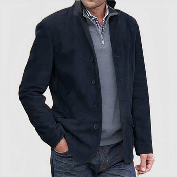 Luxury men's tan suede blazer with a single-breasted design, featuring long sleeves, a classic collar, and button closure. The blazer has an elegant and sophisticated look, suitable for formal occasions. The image showcases the Nero variant in a 3XL size.