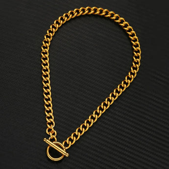 Luxury men's thick gold Cuban link bracelet featuring a bold designer statement style, showcasing intricate metalwork and a shiny gold finish.