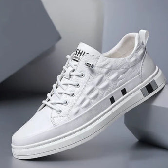 Luxury men's white leather sneakers with a crocodile texture design, variant color "Wit" in size 44. The sneakers feature an athletic style suitable for walking and casual sportswear.