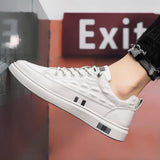 Luxury men's white leather sneakers featuring a crocodile texture design.