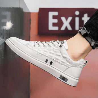 Luxury men's white leather sneakers featuring a crocodile texture design.