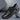 Luxury men's white leather sneakers with crocodile texture and black accents, featuring a sporty and fashionable design, suitable for outdoor and athletic activities.