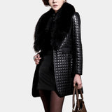 Luxury metallic quilted coat in black with a faux fur collar, featuring long sleeves and a fitted waist, displayed on a standing model in an XL size.