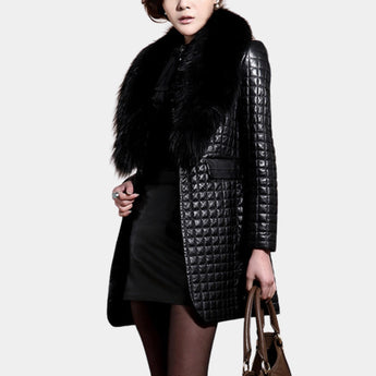 Luxury metallic quilted coat in black with a faux fur collar, featuring long sleeves and a fitted waist, displayed on a standing model in an XL size.