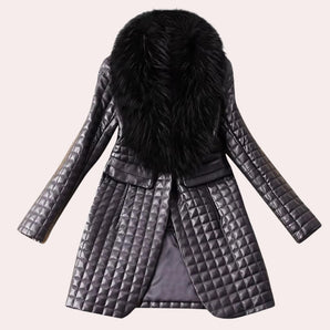 Luxury metallic quilted coat featuring a stylish black faux fur collar, long sleeves, and an elegant pattern design.