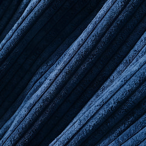 Luxury navy blue textured upholstery fabric with a subtle pattern, showcasing various shades and tints of blue.