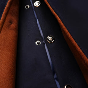 A luxury navy wool peacoat for men featuring a classic double-breasted design with prominent buttons, a tailored collar, and long sleeves, showcasing premium designer fashion in a sophisticated style.