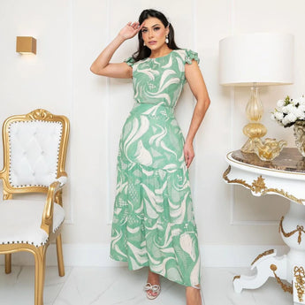 
Luxury pink floral maxi dress with elegant design, featuring long sleeves and a flattering waistline. The dress is designed for formal events and showcases intricate textile patterns, available in green, size XL.