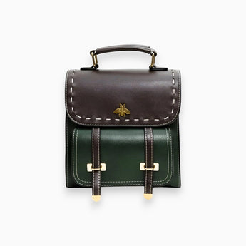 Luxurious green two-tone leather satchel with a studded flap, featuring a shoulder strap and sturdy handle, designed in a rectangular shape ideal for stylish carrying.