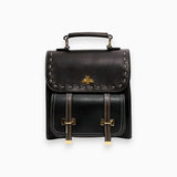 Luxury two-tone leather satchel in nero, featuring a rectangular shape with a studded flap and metal accents, equipped with a strap for easy carrying.