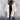 Luxury white wool cape for women in 3XL size, showcasing elegant winter fashion. The cape features a sophisticated collar and a stylish design with attention to details such as the neck and sleeves.