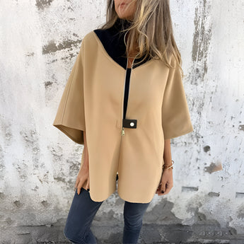 Elegant luxury white wool cape for women, featuring a classic design with a wide collar and flowing sleeves, suitable for winter fashion.