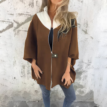 Elegant luxury white wool cape for women, featuring a stylish collar and long sleeves, ideal for winter fashion.