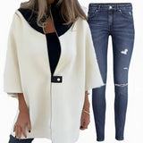 Elegant women's luxury white wool cape with a tailored fit, featuring a classic collar and long sleeves, designed for winter wear.
