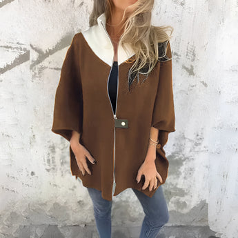 
An elegant dark brown wool cape for women in size 3XL, featuring a sophisticated design with a collar, long sleeves, and a tailored fit suitable for winter fashion.