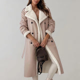 Luxury women's black leather coat with shearling lining, featuring a high collar and long sleeves, styled with an apricot-colored lining, size large.