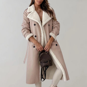 Luxury women's black leather coat with shearling lining, featuring a high collar and long sleeves, styled with an apricot-colored lining, size large.