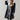Luxurious women's black leather coat with shearling lining, featuring a stylish collar, long sleeves, and a knee-length design.