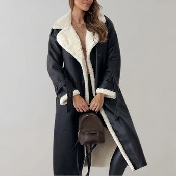 Luxury women's black leather coat with shearling lining featuring a knee-length design, tailored waist, and a cozy collar.
