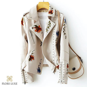 Luxury women's beige leather jacket in size 2XL, featuring intricate floral embroidery on the front and sleeves, designed with a tailored fit and classic collar for a sophisticated fashion look.