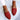 Luxury women's handcrafted red woven leather loafers, size 43, paired with blue jeans, ideal for stylish office wear.