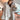 Luxury women's oversized faux fur winter coat featuring a plush texture and elegant design, highlighting the collar and sleeves. The coat showcases a fashionable, comfortable fit that extends to the waist and thighs, suitable for enhancing winter wardrobes.