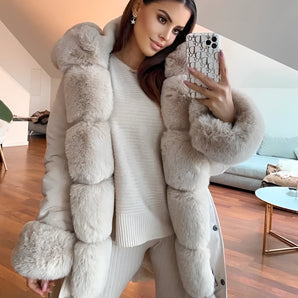 Luxury women's oversized faux fur winter coat featuring a plush texture and elegant design, highlighting the collar and sleeves. The coat showcases a fashionable, comfortable fit that extends to the waist and thighs, suitable for enhancing winter wardrobes.