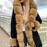 
A luxury women's oversized faux fur winter coat in black, size 3XL, with a plush, elegant design suitable for winter fashion. The coat features long sleeves and covers down to the thigh, showcasing its soft fur texture.