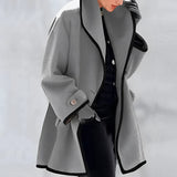Luxury women's purple wool coat with an oversized fit, featuring a contrasting lining, shown on a model highlighting the shoulder, neck, and sleeve details in a grey shade, resembling a sophisticated blazer.