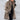 Luxury women's oversized purple wool coat with contrast lining, featuring a stylish collar, long sleeves, and fashionable design elements reminiscent of a trench coat. The coat is displayed on a mannequin, highlighting its elegant silhouette and quality craftsmanship.