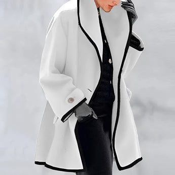 Luxury women's purple wool coat with oversized fit and fashionable contrast lining, featuring long sleeves, elegant collar, and stylish design. Modeled by a woman wearing sunglasses, showcasing a chic and sophisticated look.