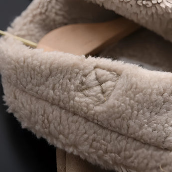 Luxury women's tan suede faux fur winter jacket with long sleeves, featuring a cozy and comfortable woolen texture, highlighted in beige tones.