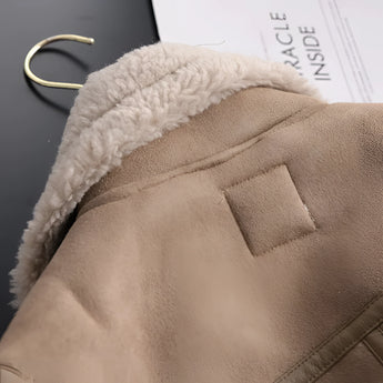 Luxury women's tan suede winter jacket featuring faux fur trim, long sleeves, and button detailing.