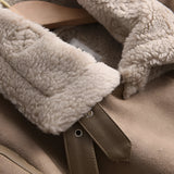 Luxury women's tan suede winter jacket with faux fur collar and lining, featuring long sleeves and a cozy fit. The jacket is shown on a model highlighting the comfortable and stylish design, with emphasis on the soft, natural materials.