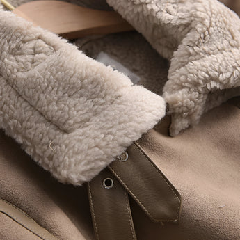 Luxury women's tan suede winter jacket with faux fur collar and lining, featuring long sleeves and a cozy fit. The jacket is shown on a model highlighting the comfortable and stylish design, with emphasis on the soft, natural materials.