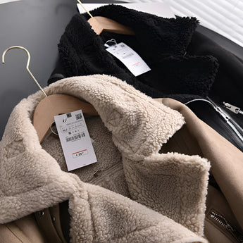 Luxury women's tan suede winter jacket featuring faux fur lining and collar, with long sleeves for added warmth and comfort.