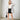 Luxury women's white and gray faux fur coat showcasing winter fashion, featuring long sleeves and a tailored fit that emphasizes the waist.